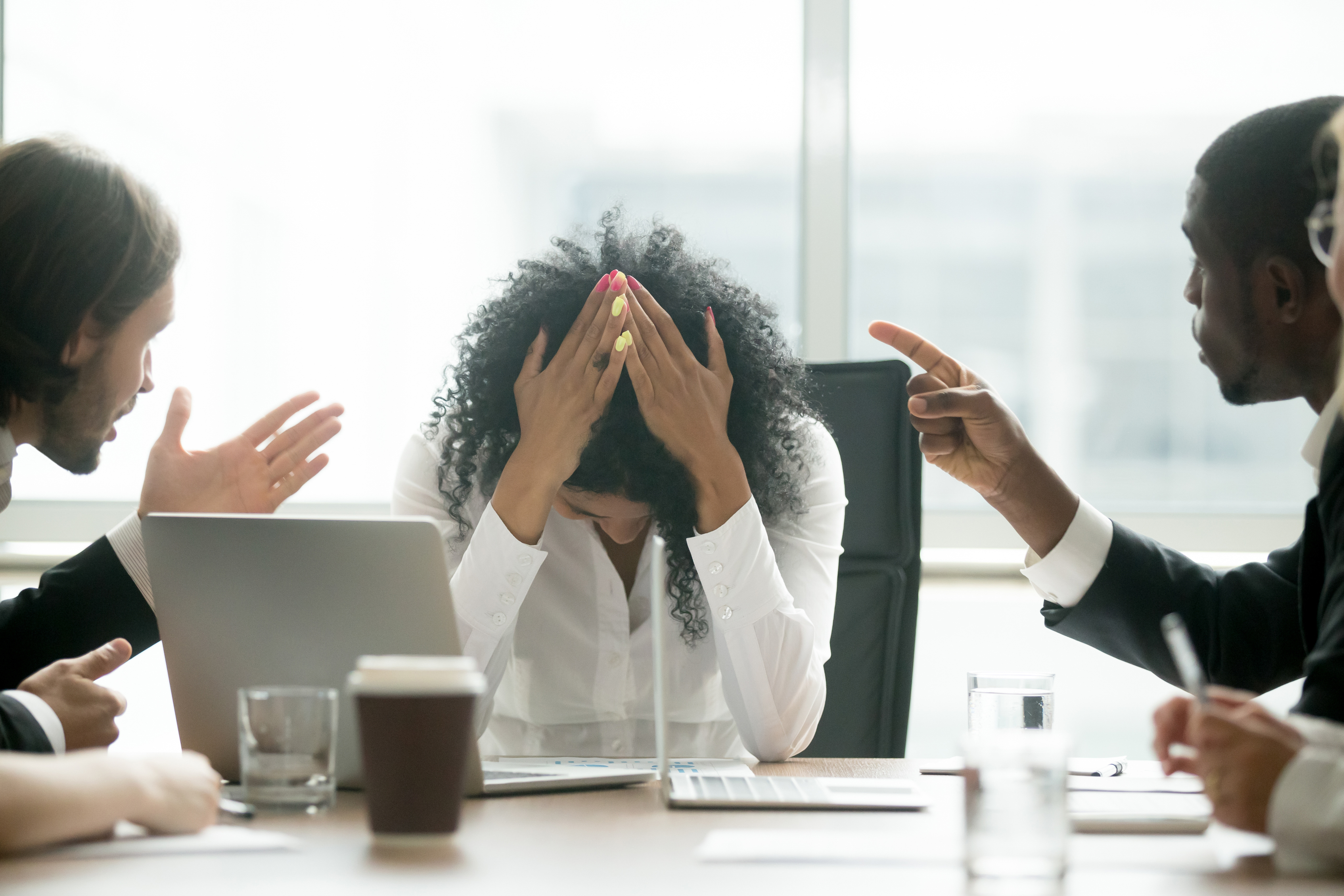 Depressed black woman leader suffering from gender discrimination at work